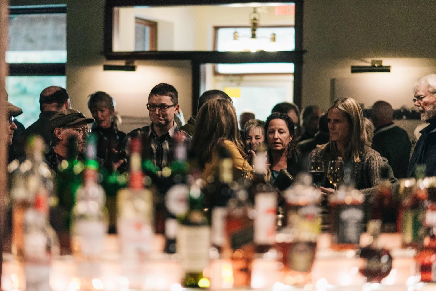A full crowd at the bar during an evening event