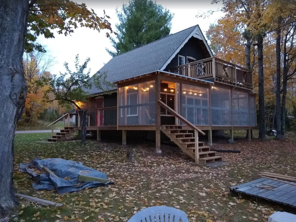 The cabin in the woods at dusk