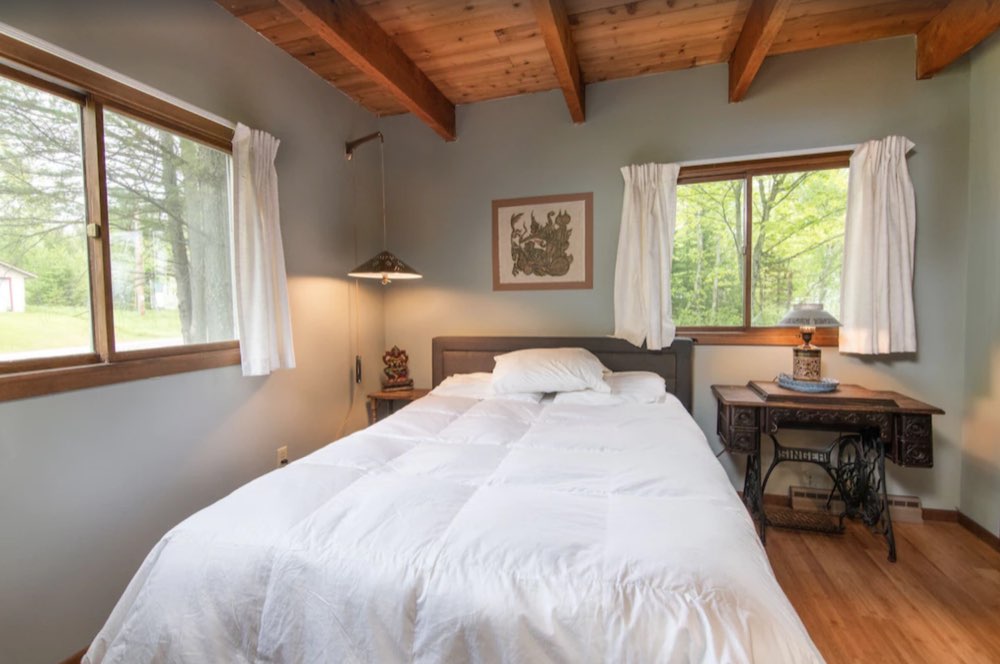 Bedroom with a white comforter