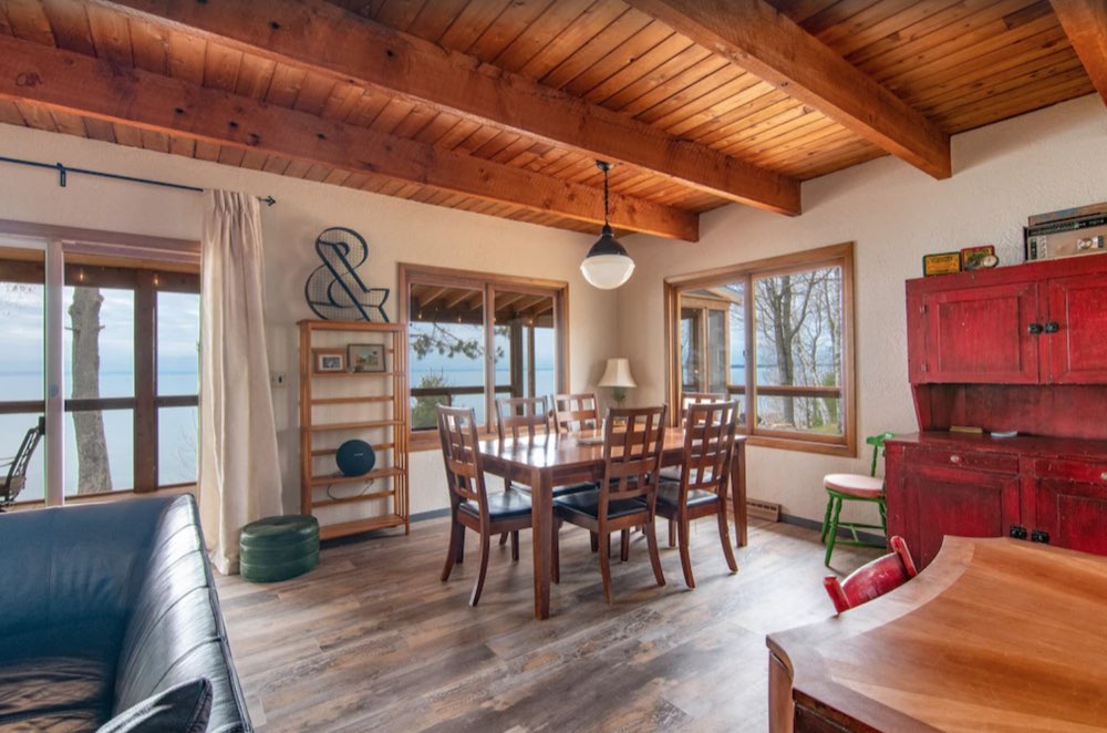 Living and dining room with wood ceilings