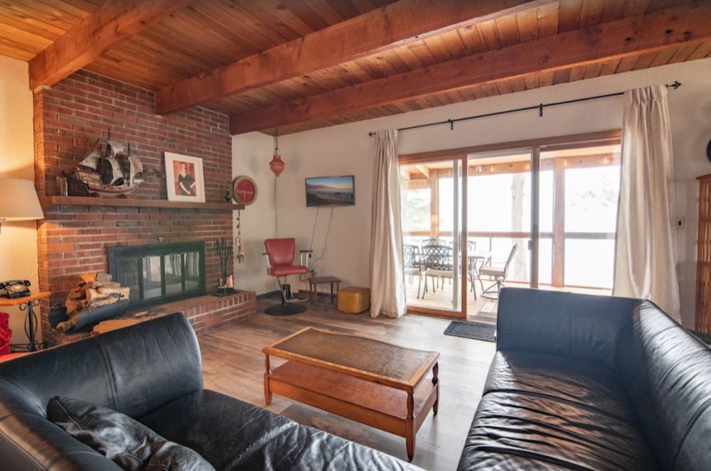 Living room with a brick fireplace