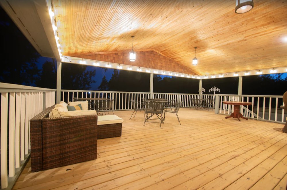 The covered deck lit up at night