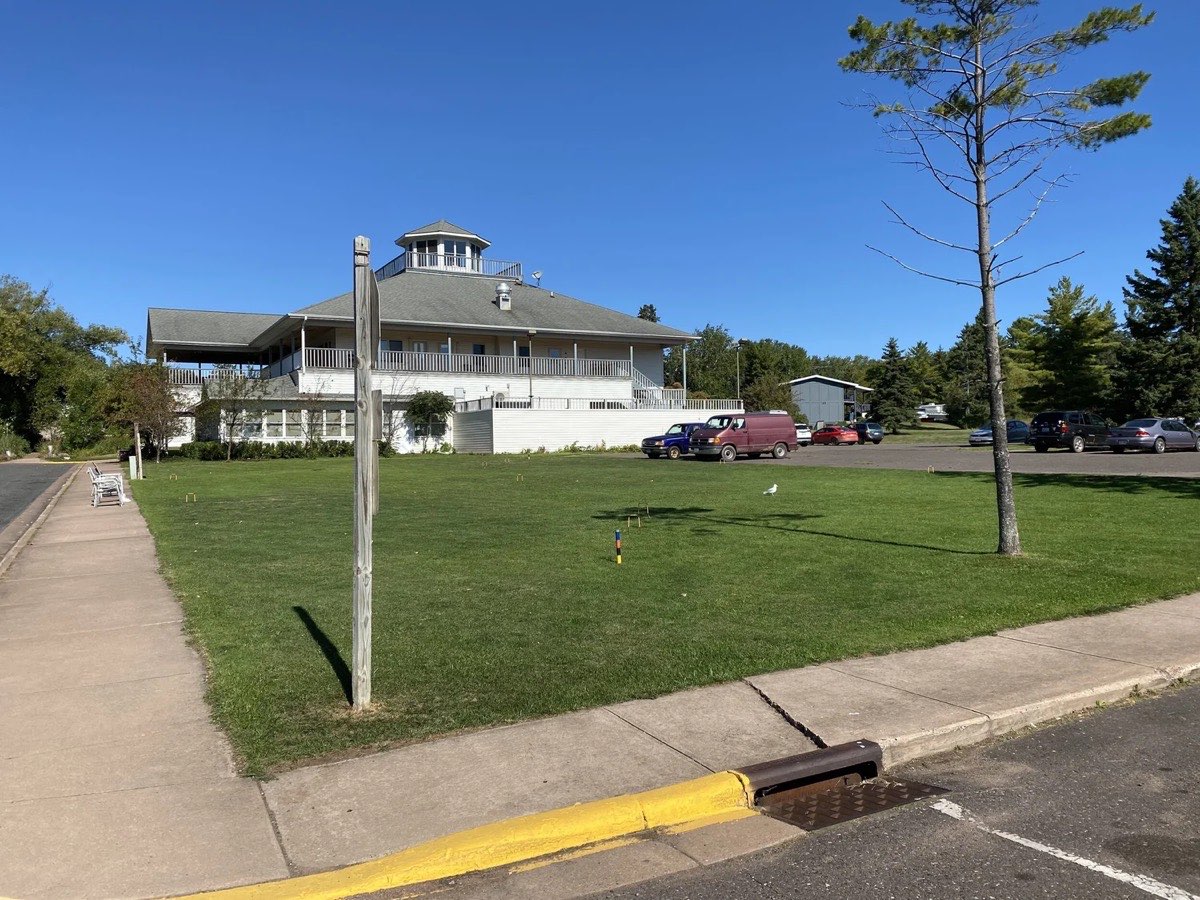 The side yard and parking area beside the building